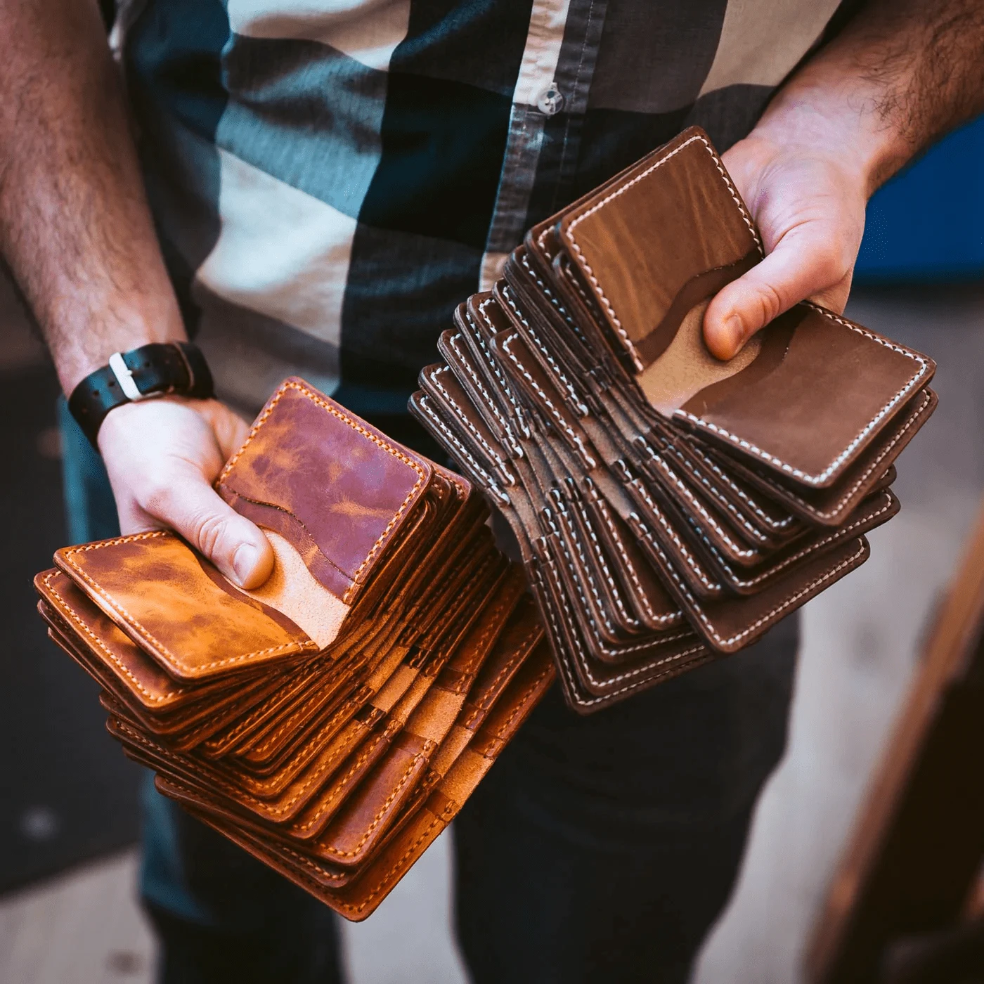Hands fanning out a stack of Mystery Wallet seconds